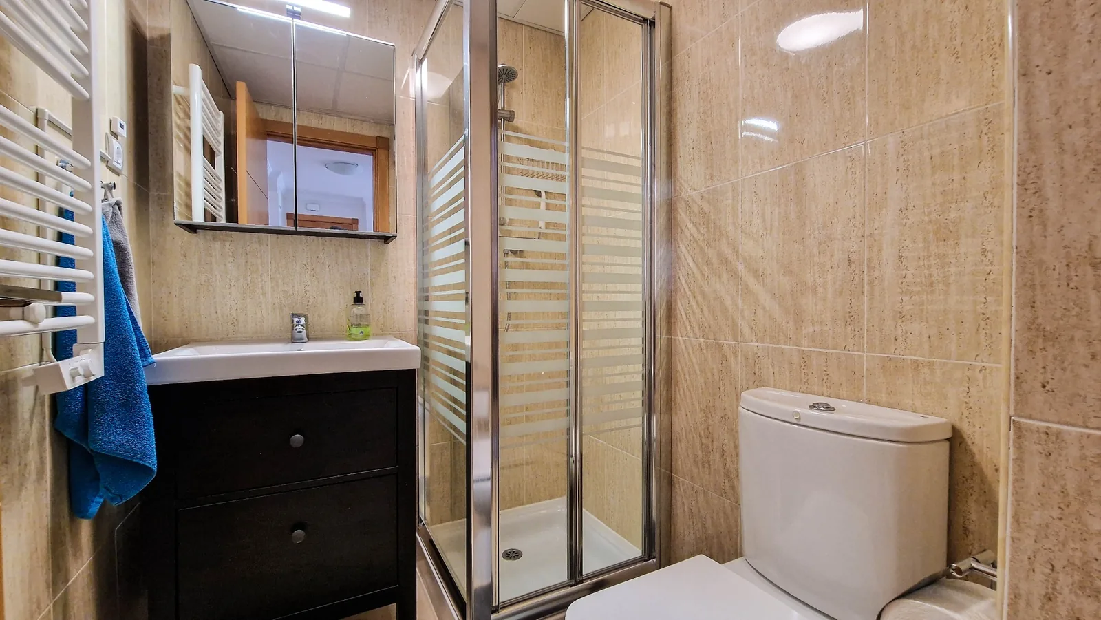 Bathroom with enclosed shower
